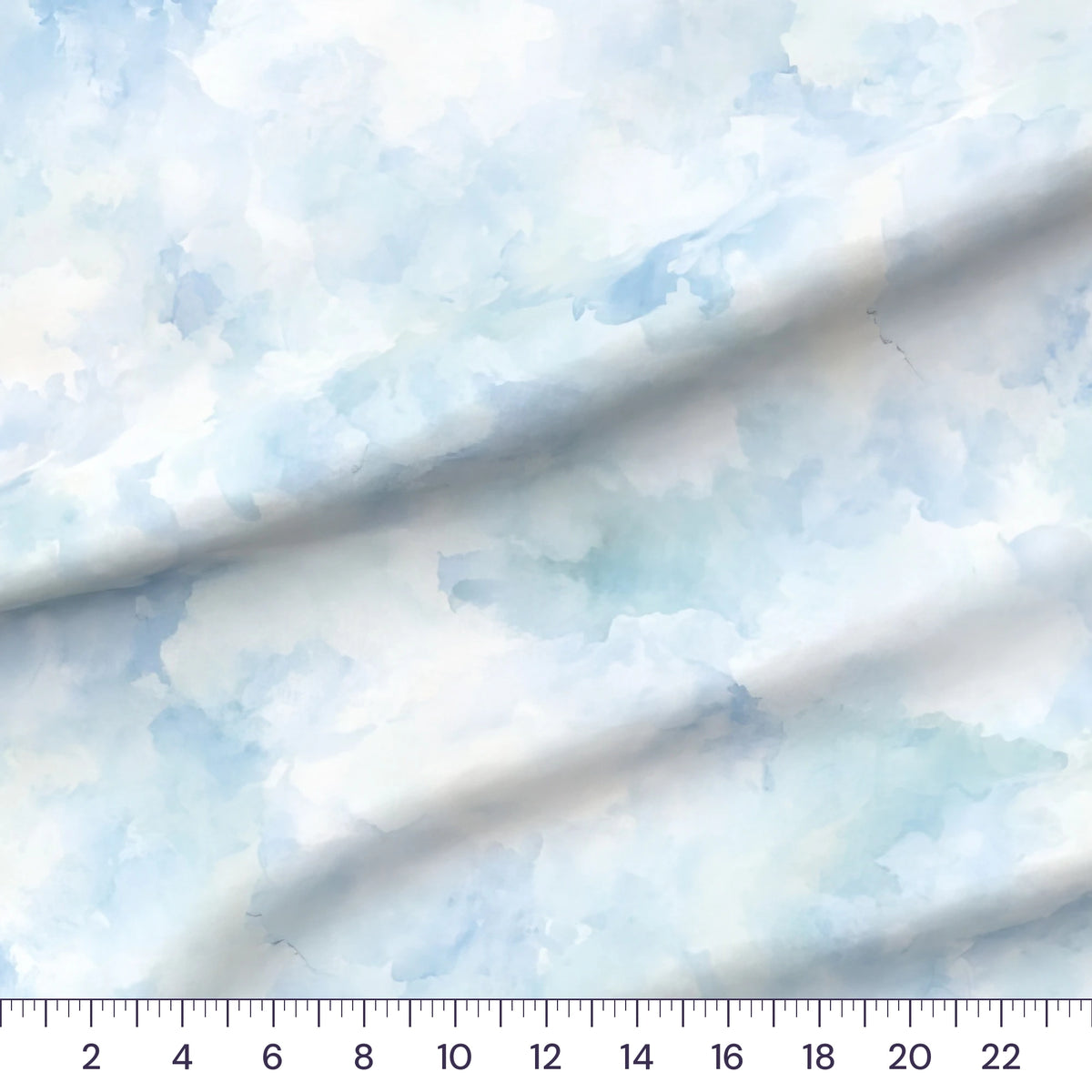 Whimsical Whale Ocean Texture blender quilting cotton draped close-up with a ruler showing true print scale