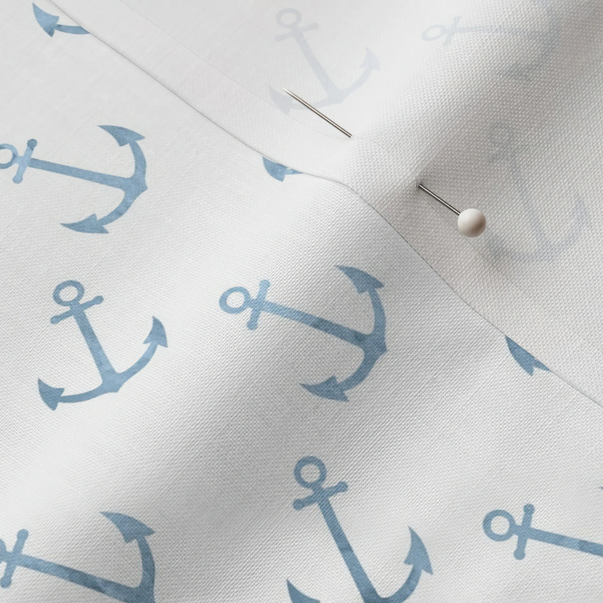 Pinned close-up of Anchors fabric showing the white selvage margin