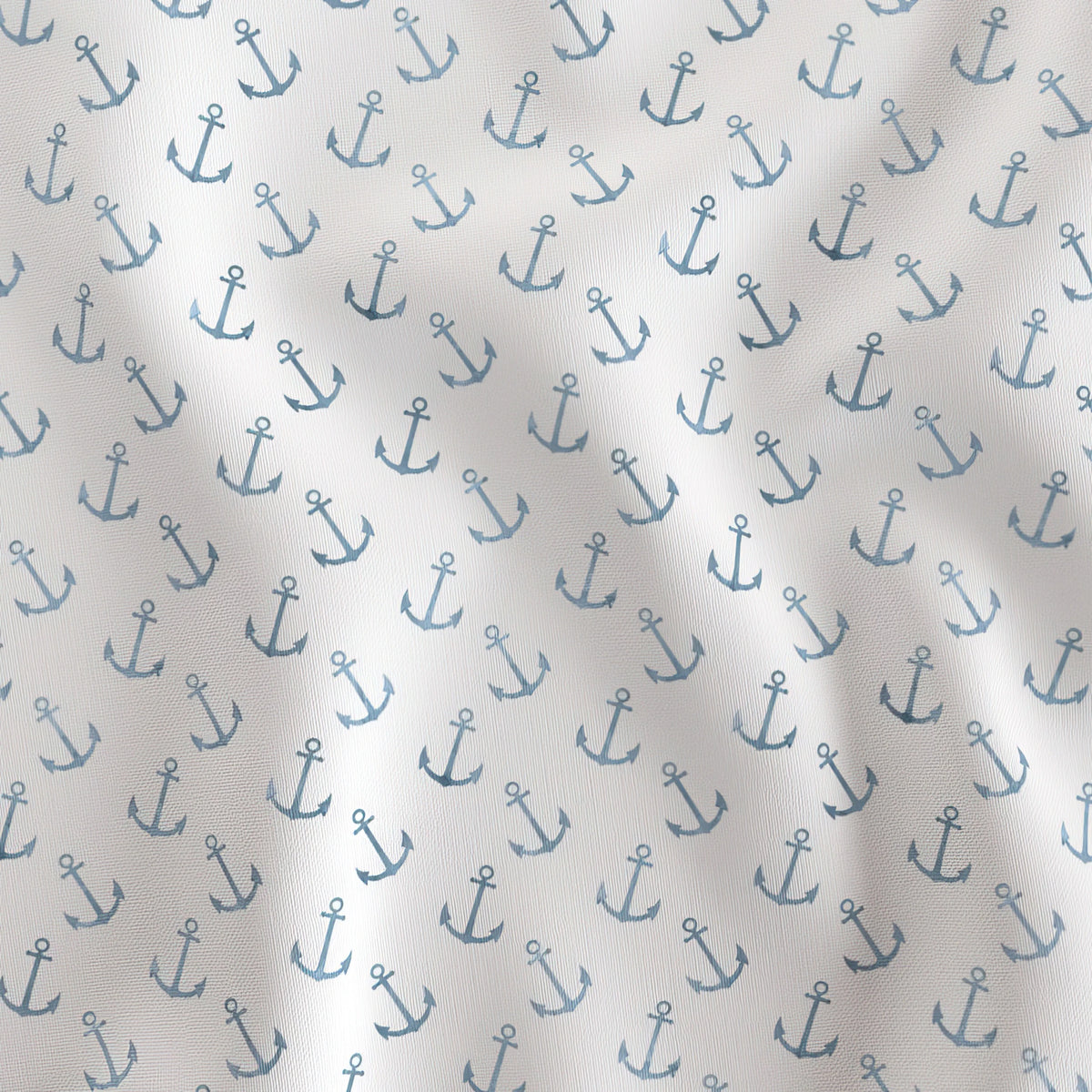 Delicate blue anchor quilting cotton draped to show the soft hand