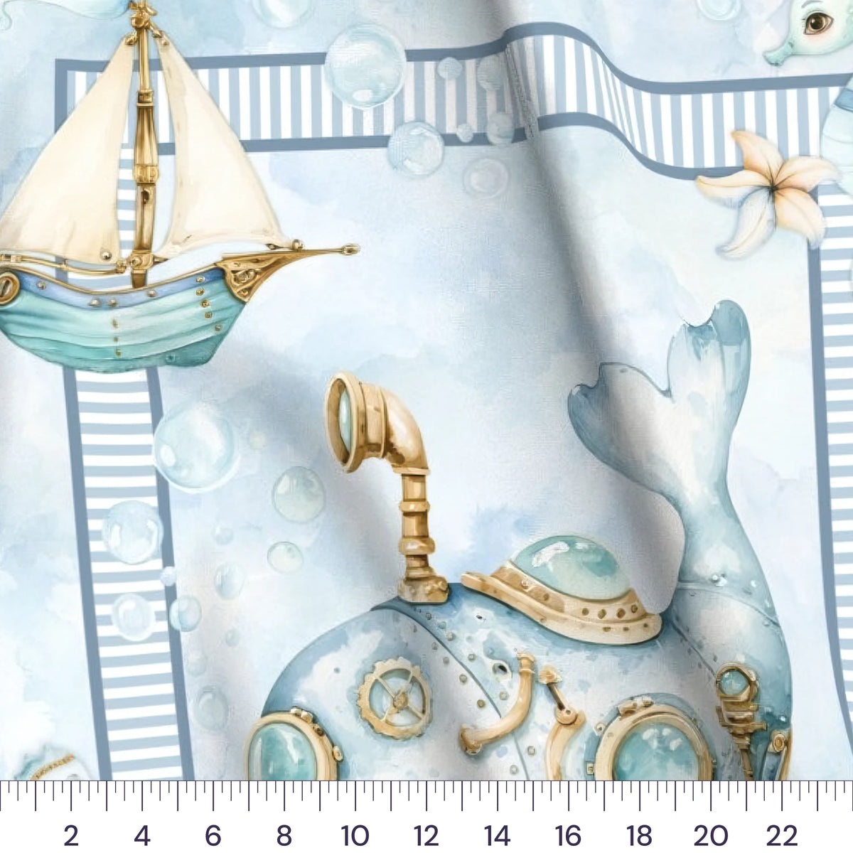 Close-up of the Whimsical Whale baby quilt panel with a ruler showing true scale