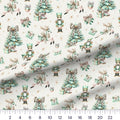 Coquette Christmas Mint quilting cotton fabric – draped close-up with a ruler showing true print scale