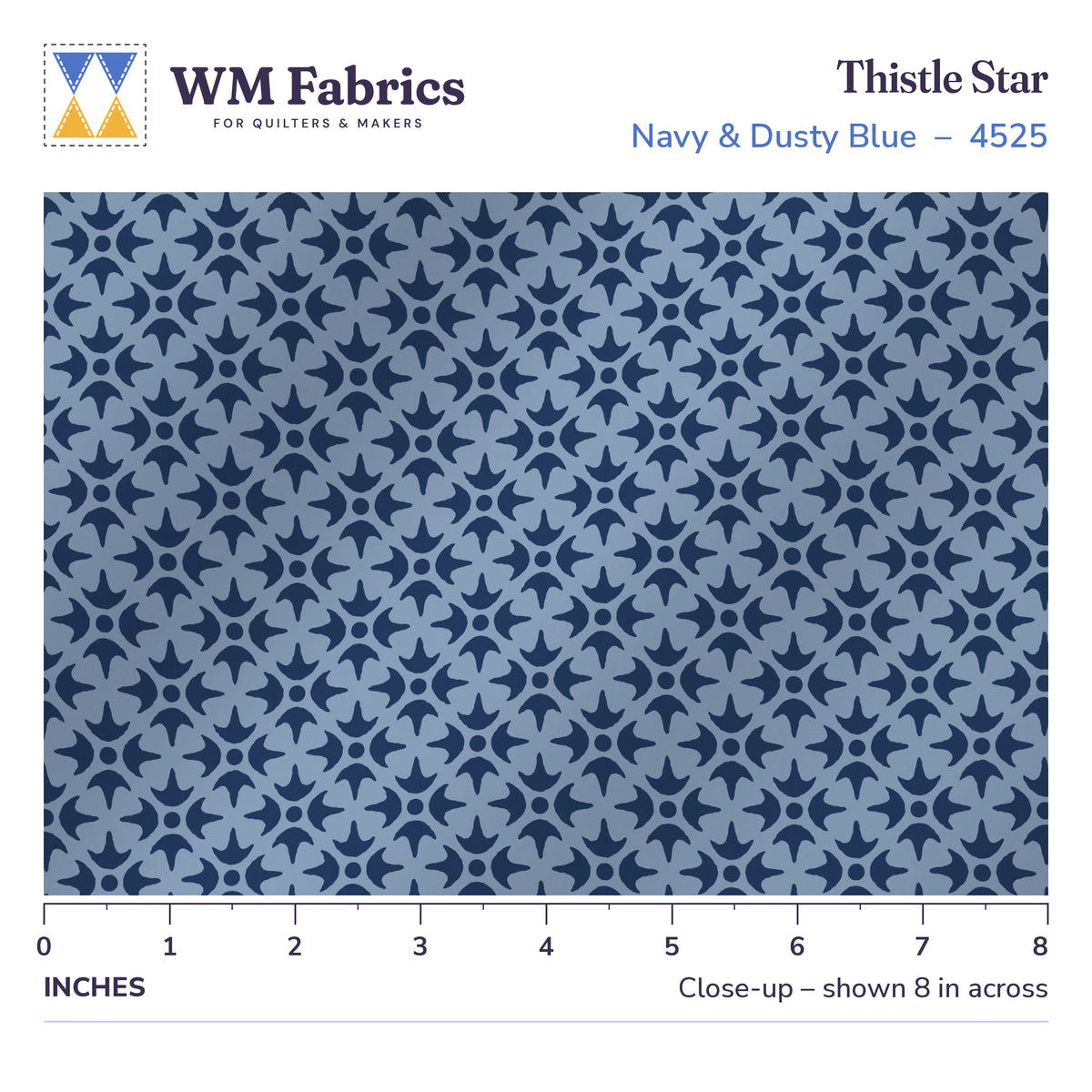 8 inch close-up of Thistle Star Navy & Dusty Blue quilting cotton with a ruler showing the true size of the print