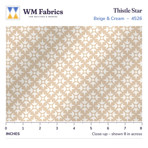 8 inch close-up of Thistle Star Beige & Cream quilting cotton with a ruler showing the true size of the print