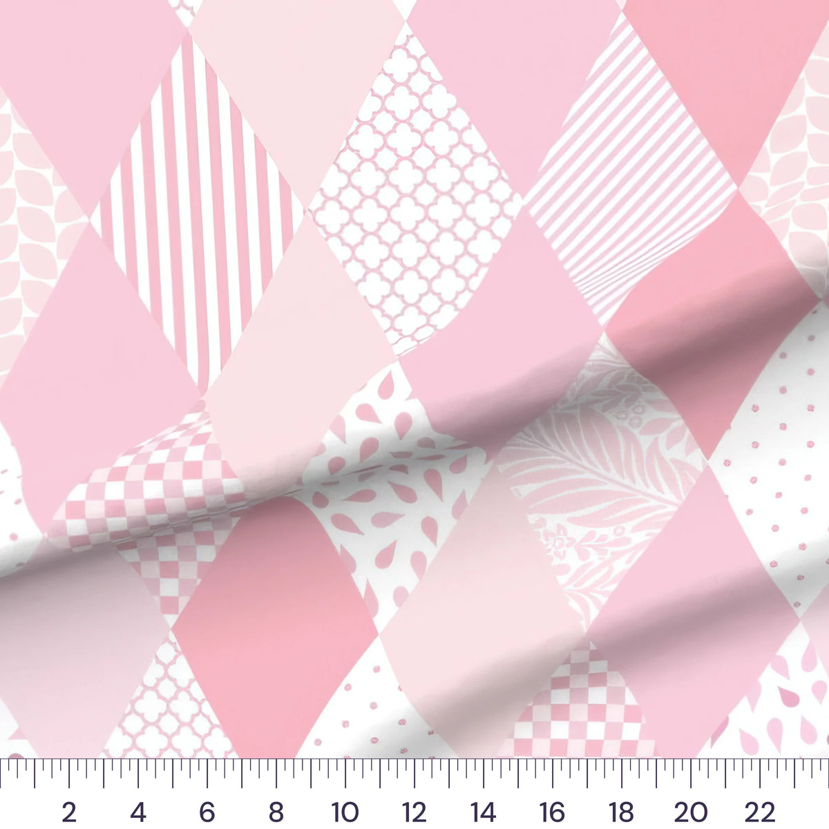 Pink diamond baby girl cheater quilt fabric by the yard with 6 inch blocks, draped quilting cotton with a ruler showing true scale
