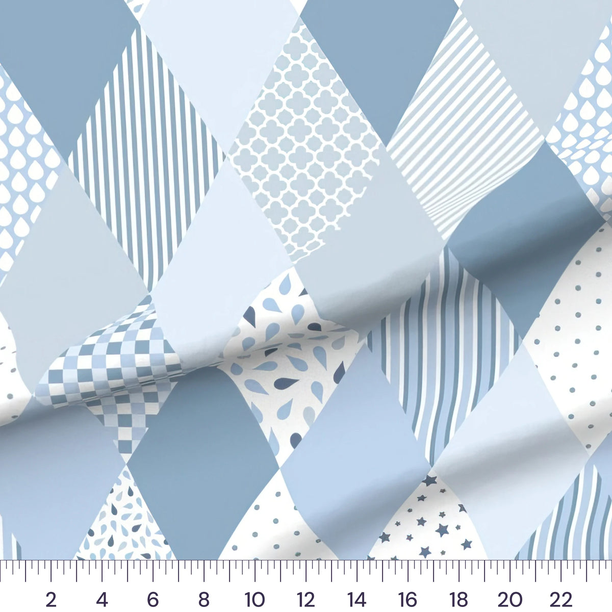 Blue diamond baby boy cheater quilt fabric by the yard with 6 inch blocks, draped quilting cotton with a ruler showing true scale