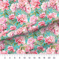 Watercolor Peony Aqua quilting cotton fabric – draped close-up with a ruler showing true print scale