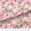 Watercolor Peony Pink quilting cotton fabric – draped close-up with a ruler showing true print scale