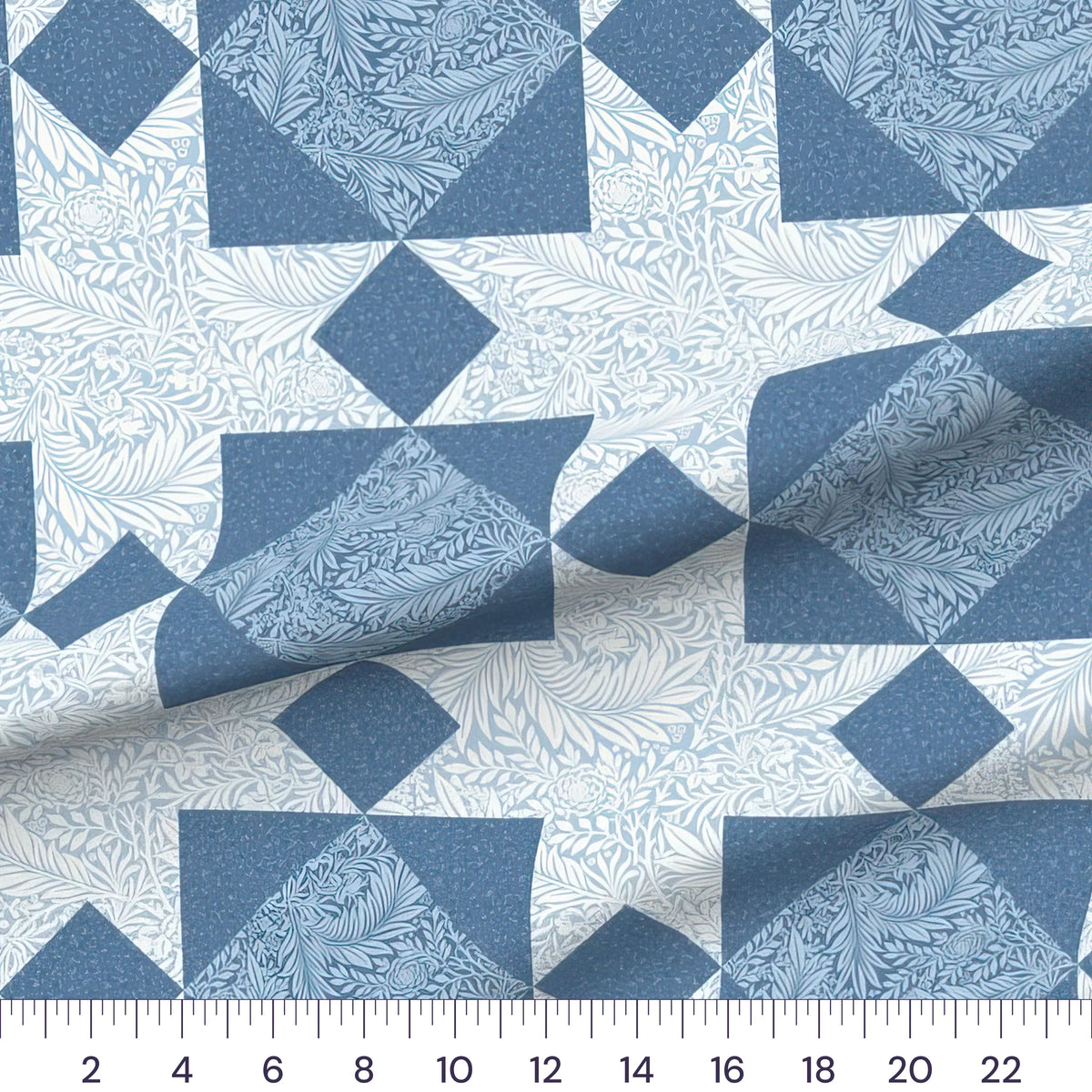 William Morris Larkspur blue star cheater quilt fabric by the yard with 12 inch star blocks, draped quilting cotton with a ruler showing true scale