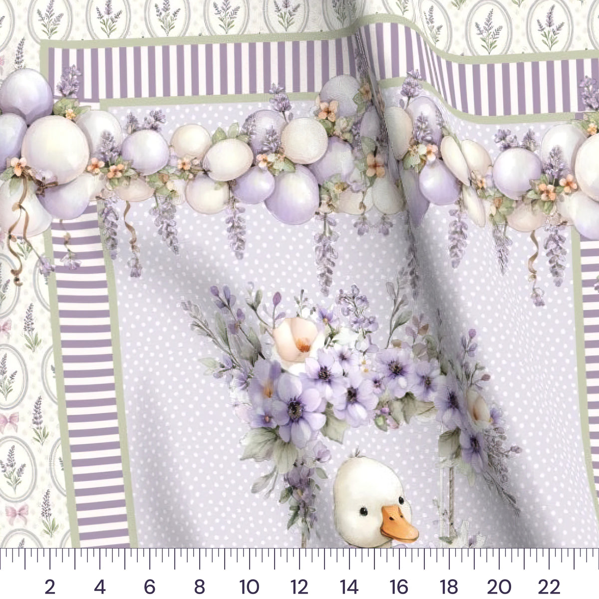 Close-up of the Lavender Goose baby quilt panel with a ruler showing true scale