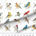 North American Songbirds quilting cotton fabric – draped close-up with a ruler showing true print scale