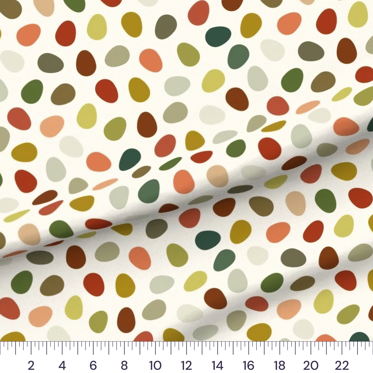 Bird Eggs quilting cotton fabric – draped close-up with a ruler showing true print scale