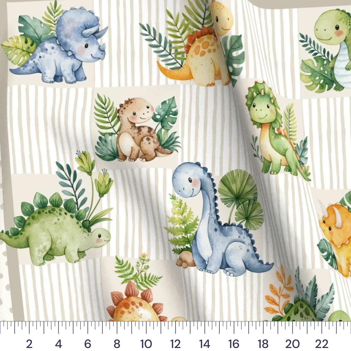 Close-up of the Little Jurassic baby quilt panel with a ruler showing true scale
