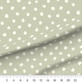Sage Dots quilting cotton fabric – draped close-up with a ruler showing true print scale
