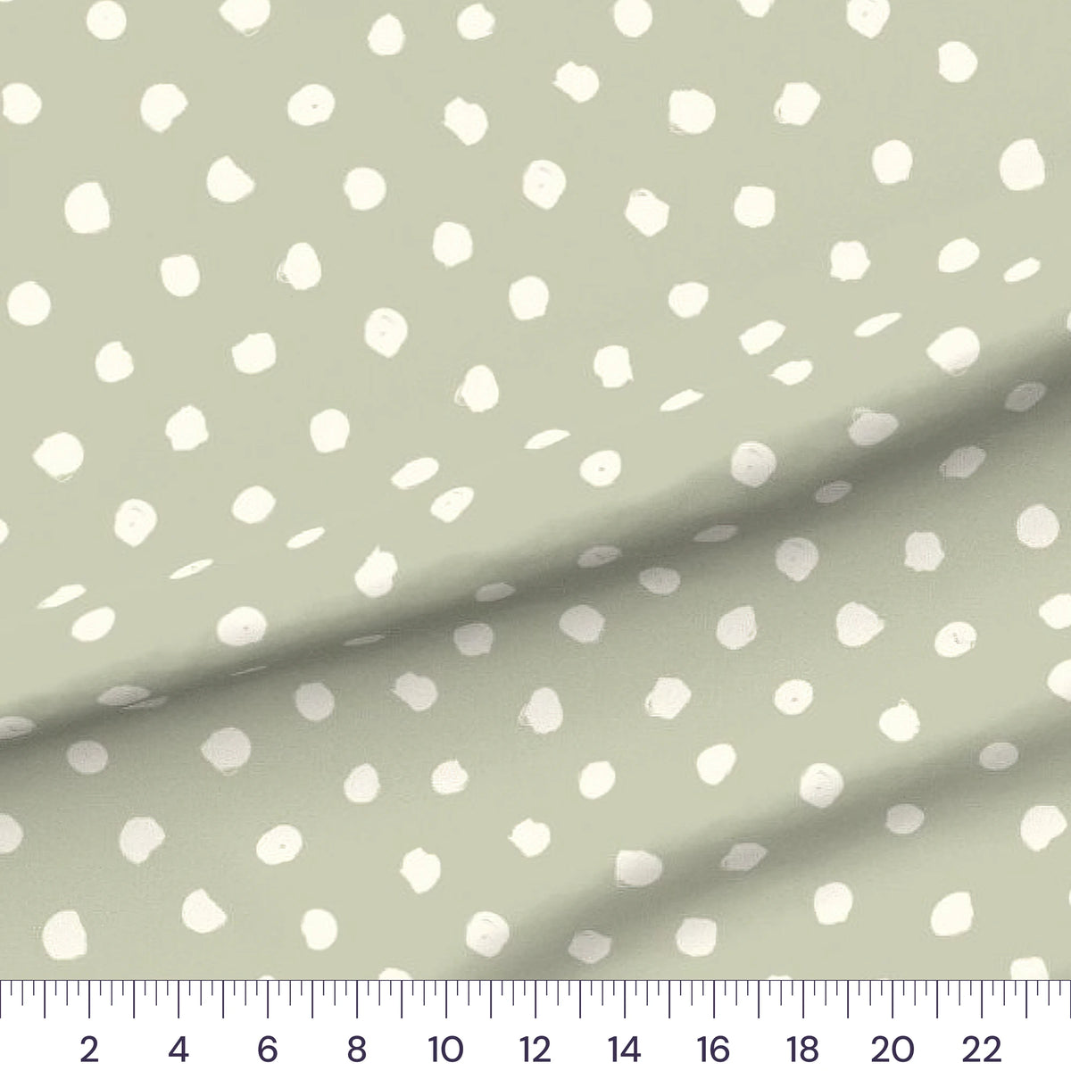 Sage Dots quilting cotton fabric – draped close-up with a ruler showing true print scale