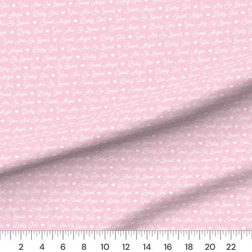 Baby Girl Script quilting cotton fabric – draped close-up with a ruler showing true print scale