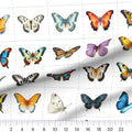 Butterfly Blocks quilting cotton fabric – draped close-up with a ruler showing true print scale