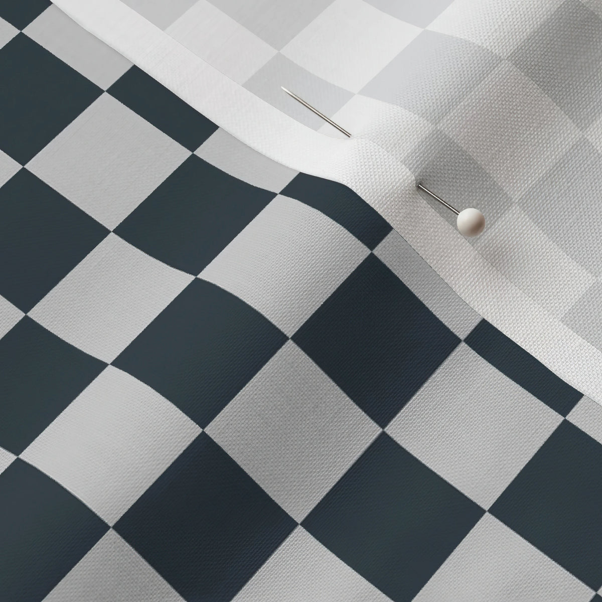 Pinned close-up of Charcoal Checker fabric showing the white selvage margin