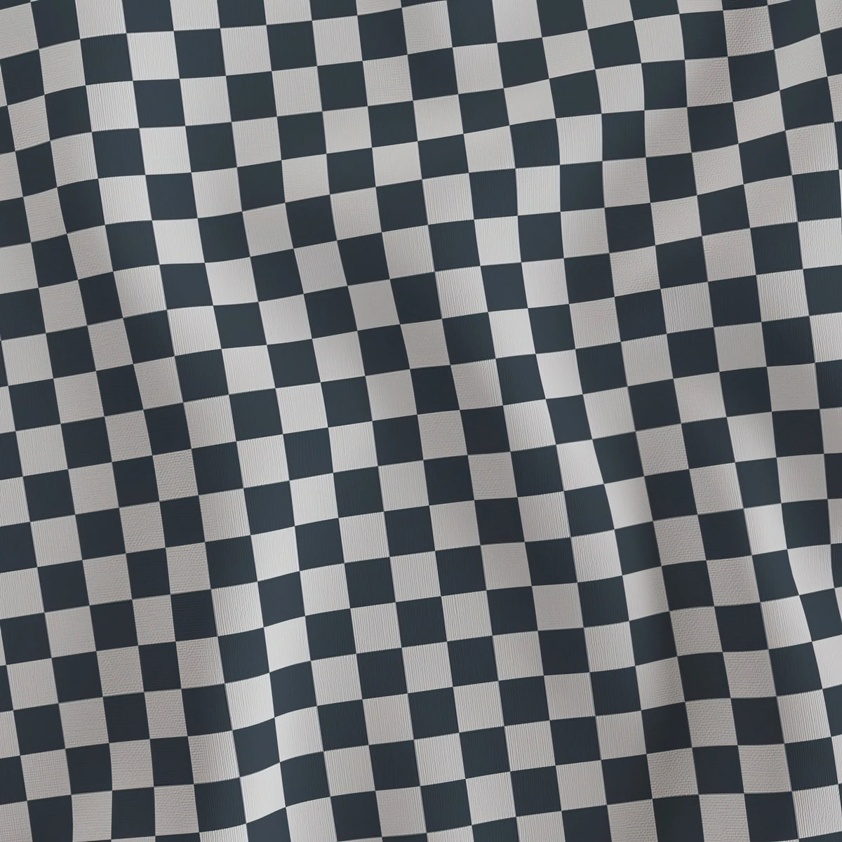 Charcoal and light gray checkerboard quilting cotton draped to show the soft hand