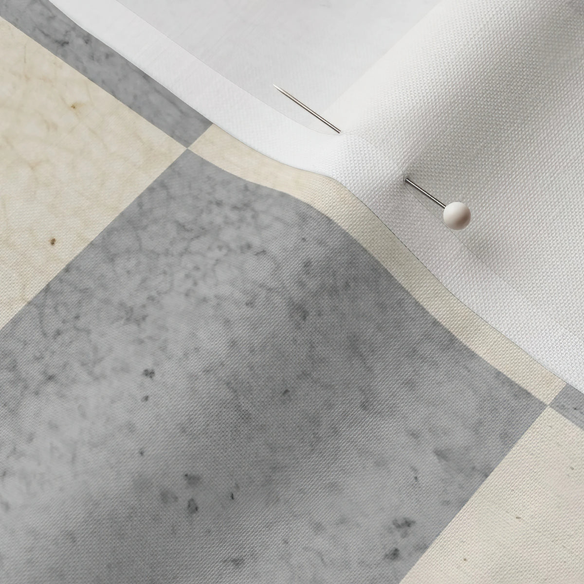 Pinned close-up of Concrete Checker fabric showing the white selvage margin