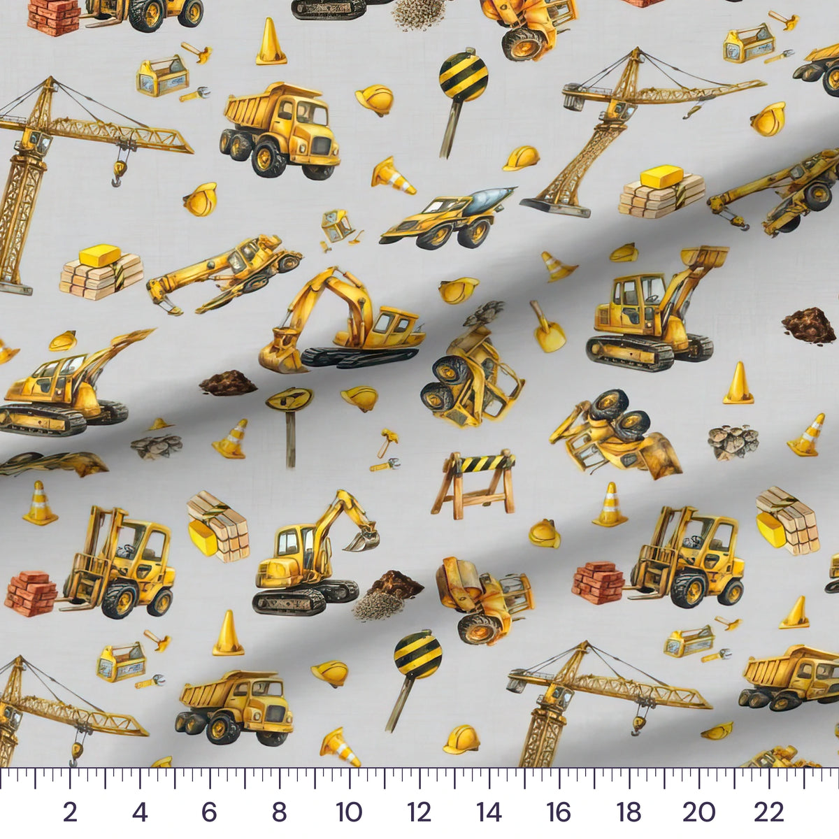 Little Diggers Toss quilting cotton close-up with a ruler showing the construction trucks at true scale