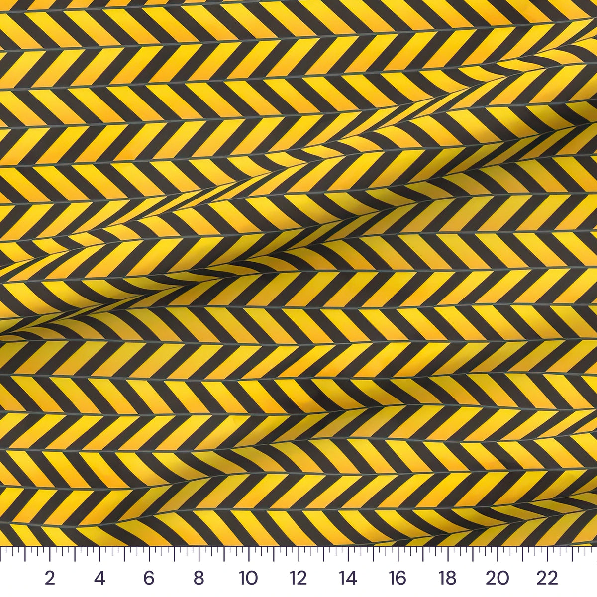 Caution Chevron yellow and black quilting cotton close-up with a ruler showing true scale
