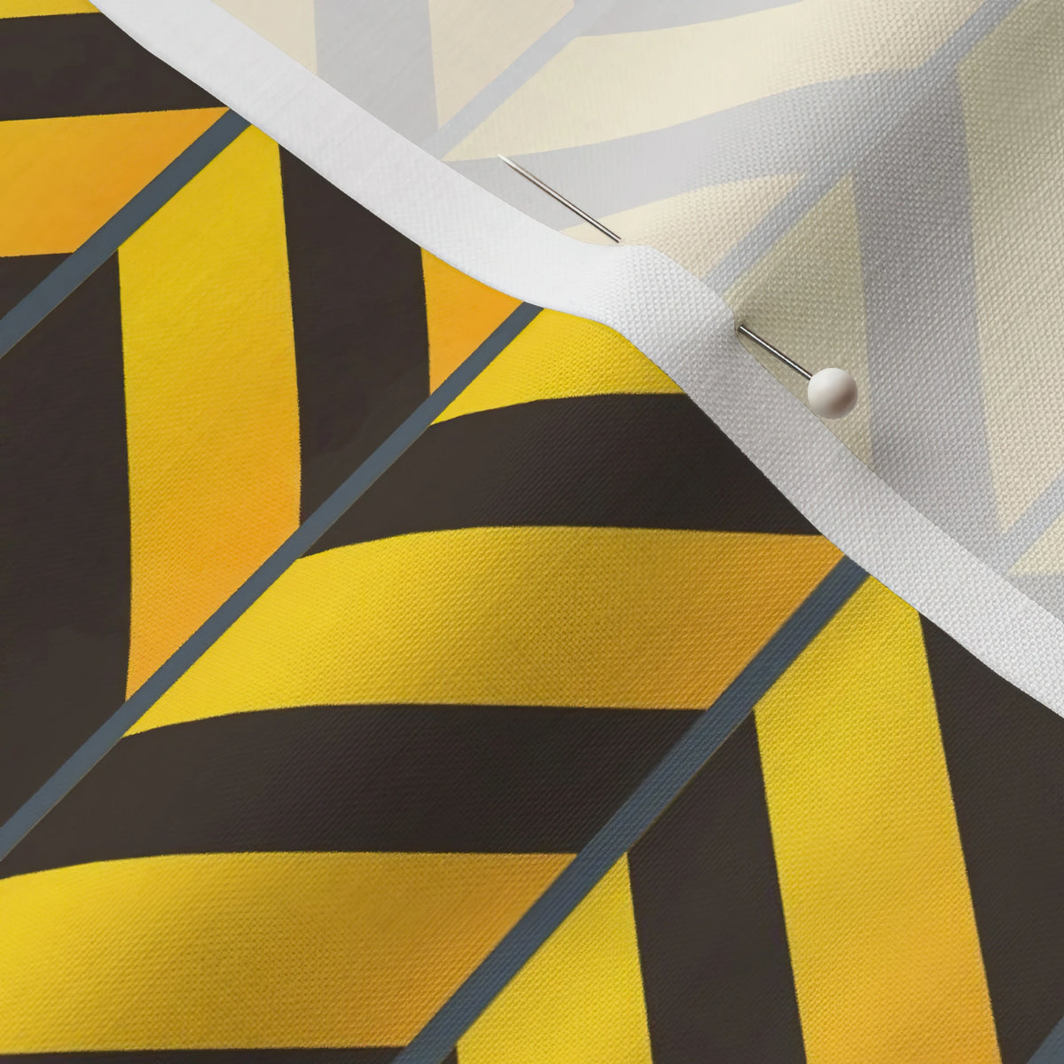 Pinned close-up of Caution Chevron fabric showing the white selvage margin