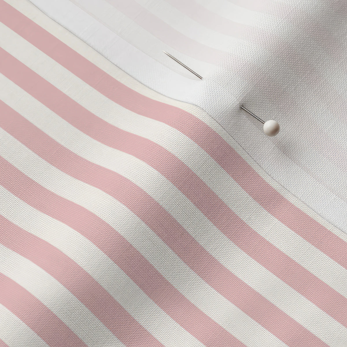 Pinned close-up of Rose Petal 1/4 inch stripe fabric showing the white selvage margin