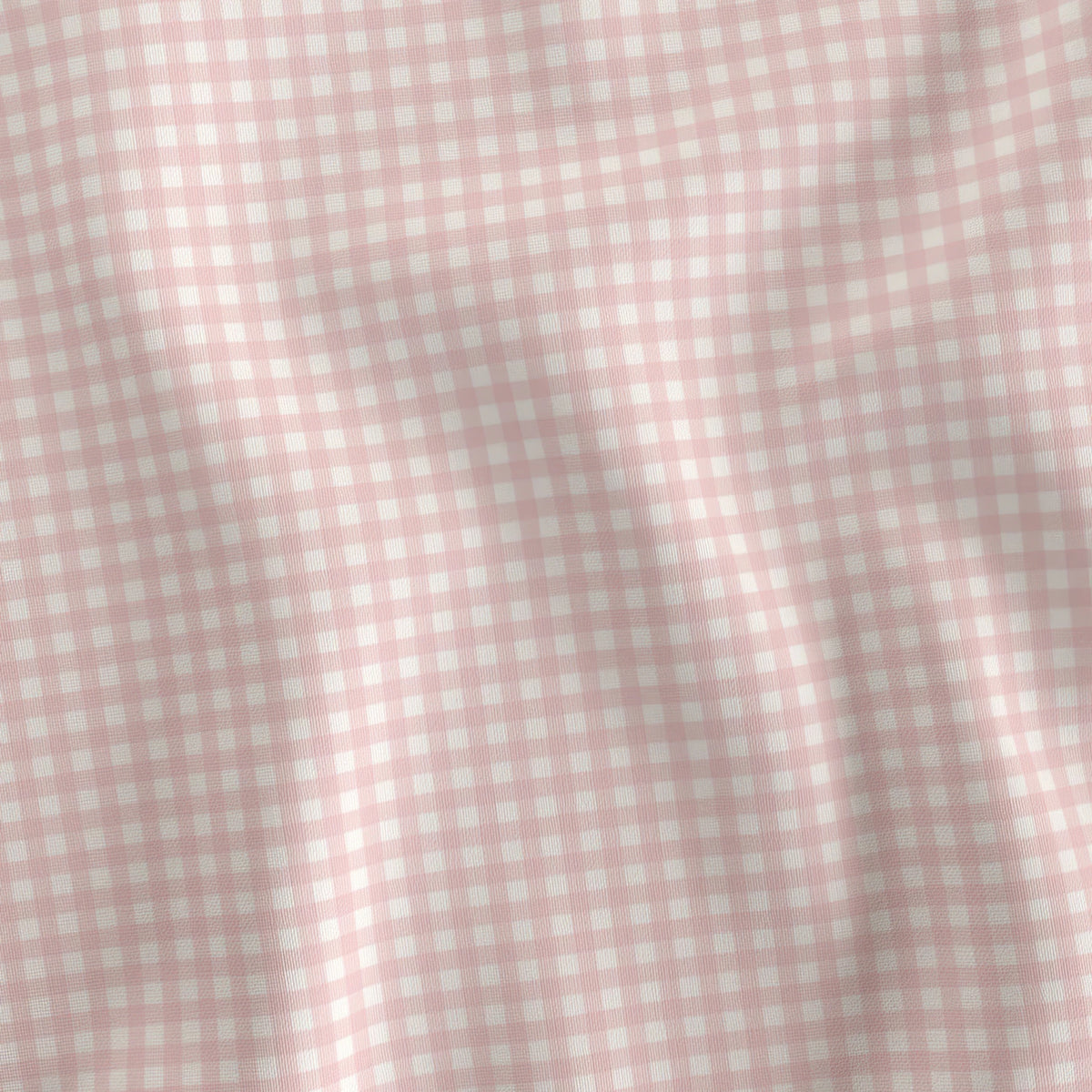 Soft pink and cream mini gingham quilting cotton draped to show the soft hand