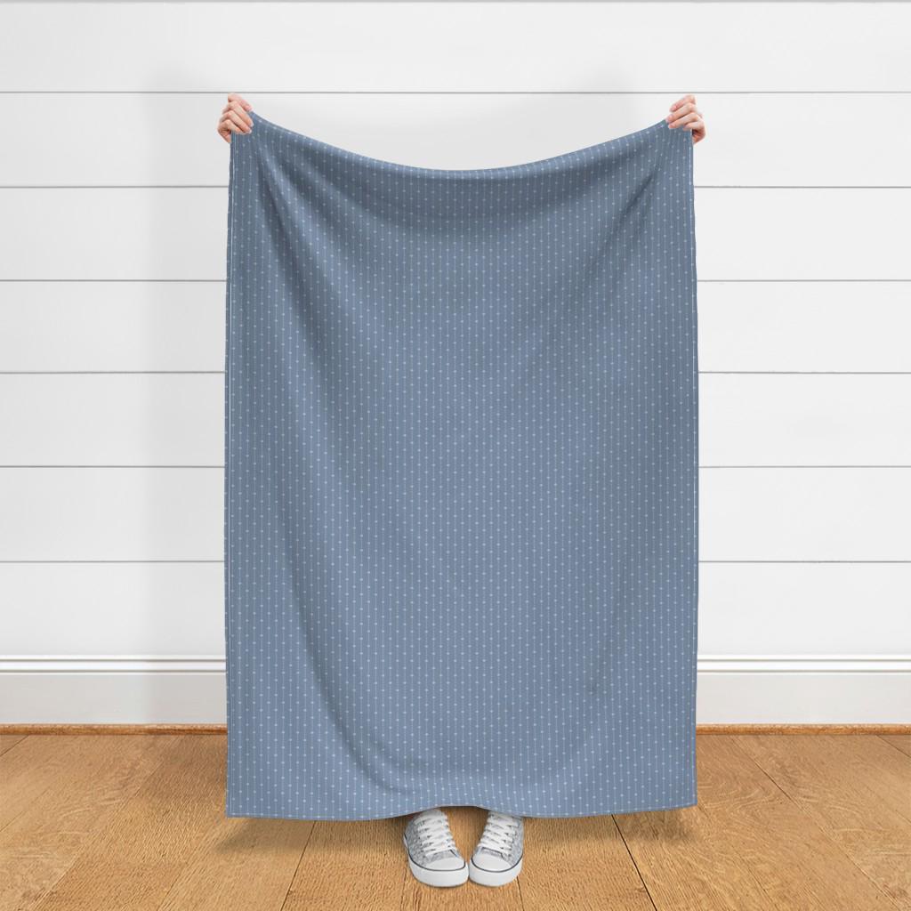 Full yard of Ivory on Blue ditsy star stripe fabric held up to show the size of one yard