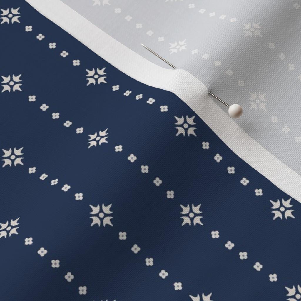 Navy blender fabric showing the navy geometric dot print on cotton quilting fabric