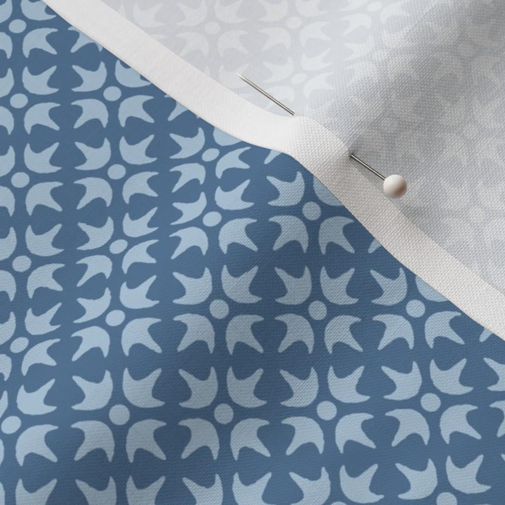 Dusty Blue Thistle Star fabric showing the dusty blue geometric lattice print on cotton quilting fabric