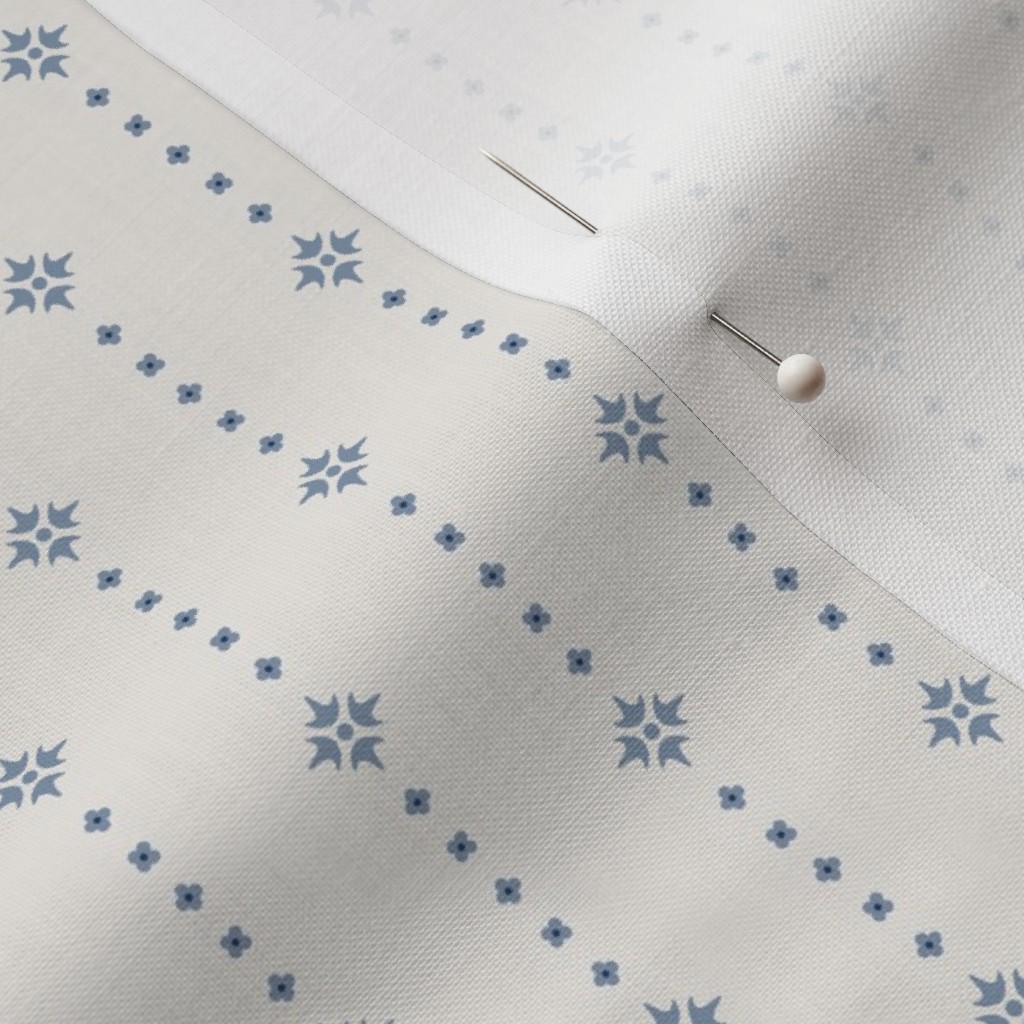 Blue on Ivory ditsy star stripe fabric close-up – soft blue star stripe on ivory quilting cotton fabric by the yard