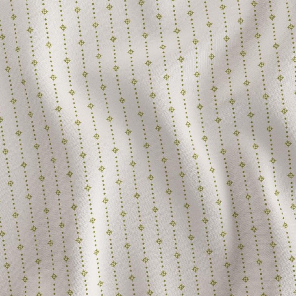 Golden Olive ditsy star stripe fabric draped to show the soft hand and golden olive star stripe on ivory print