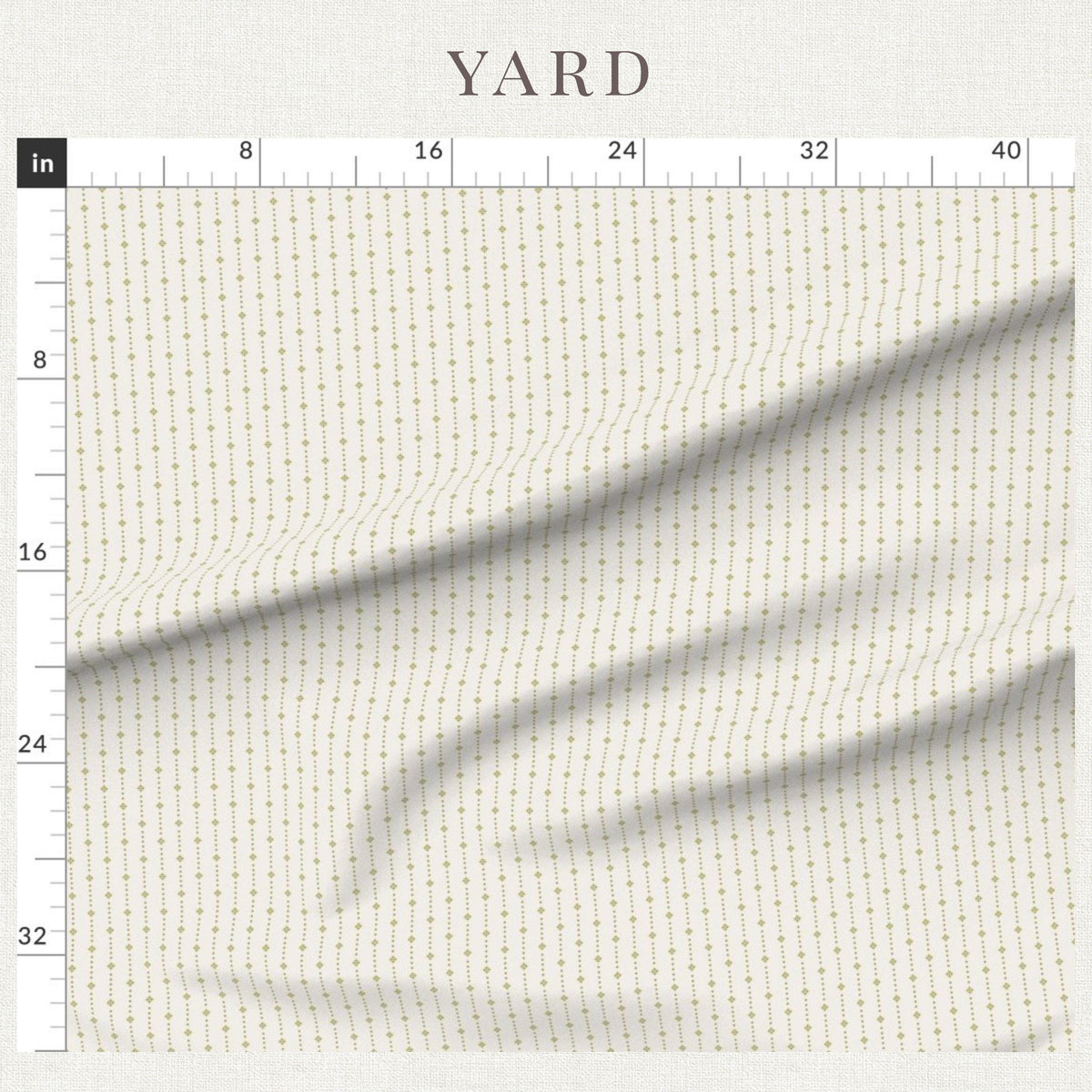 Golden Olive ditsy star stripe fabric beside a ruler showing the print scale