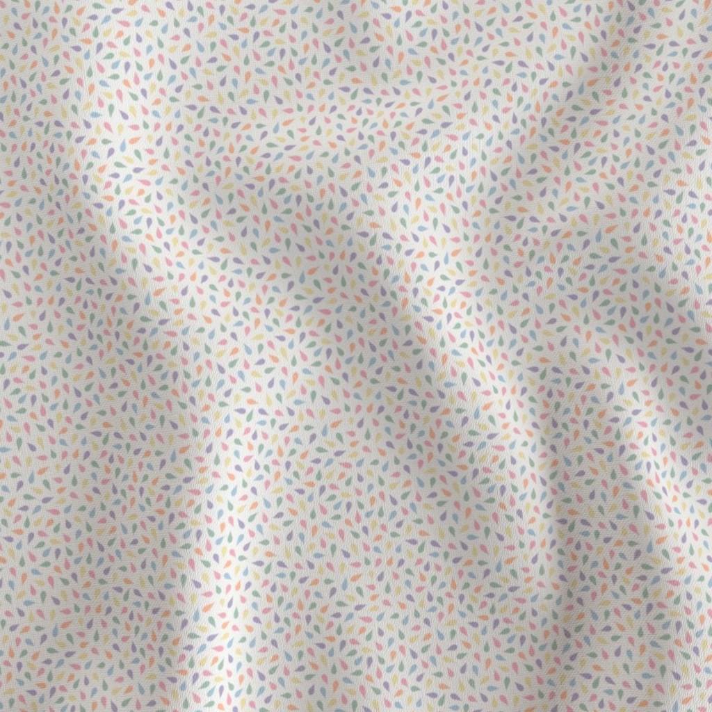 Pastel on Cream ditsy confetti fabric showing the pastel ditsy confetti petal print on cotton quilting fabric