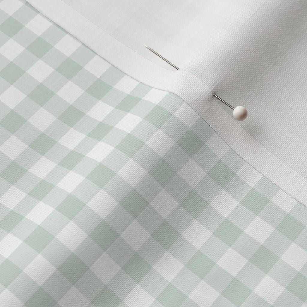 1/4 in Check gingham fabric showing the small sage green gingham print on cotton quilting fabric