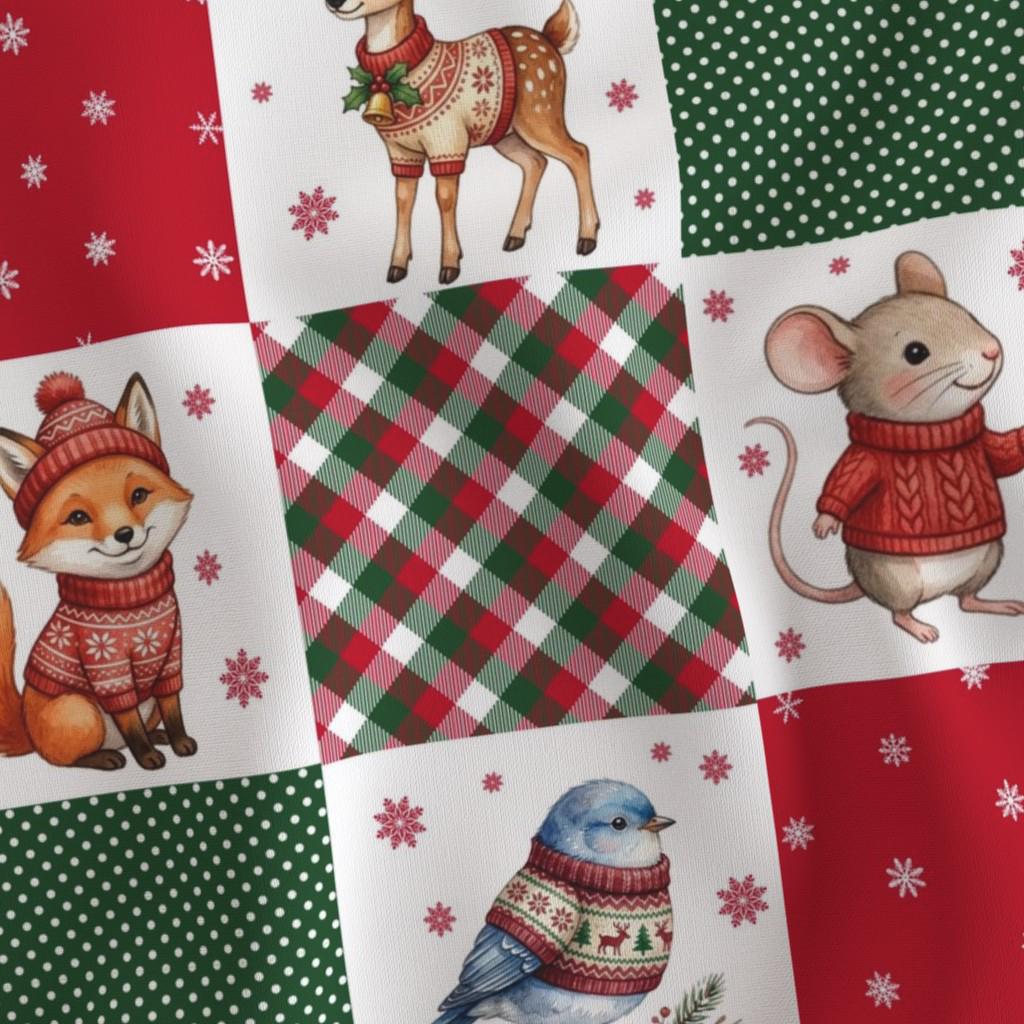 Close-up of Christmas quilt blocks with plaid, animals, snowflakes and sweater prints