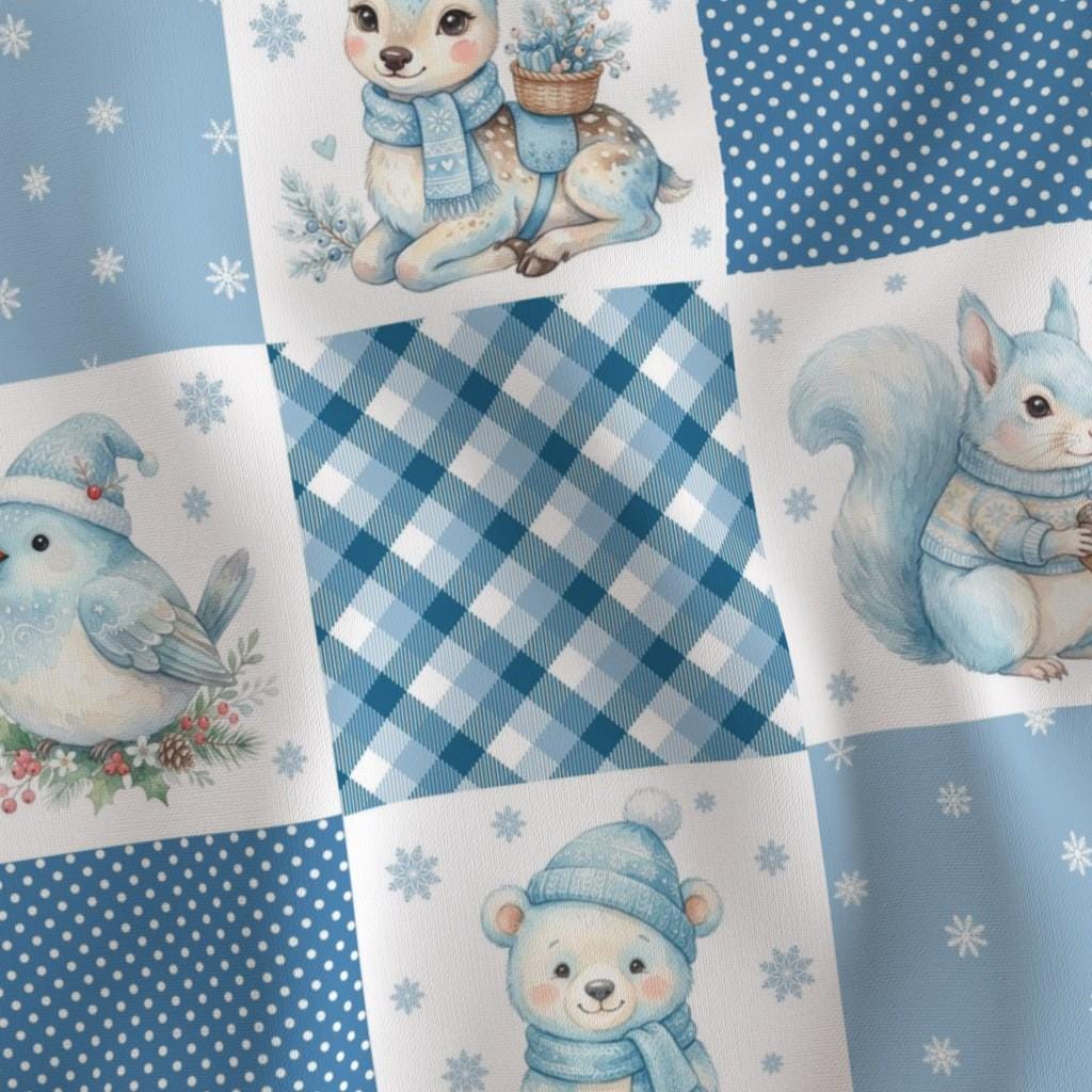 Close-up of watercolor woodland animals, gingham and snowflakes on Christmas patchwork blocks