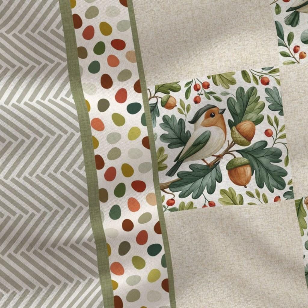Close-up of watercolor birds, oak leaves, acorns and linen texture on the baby quilt panel