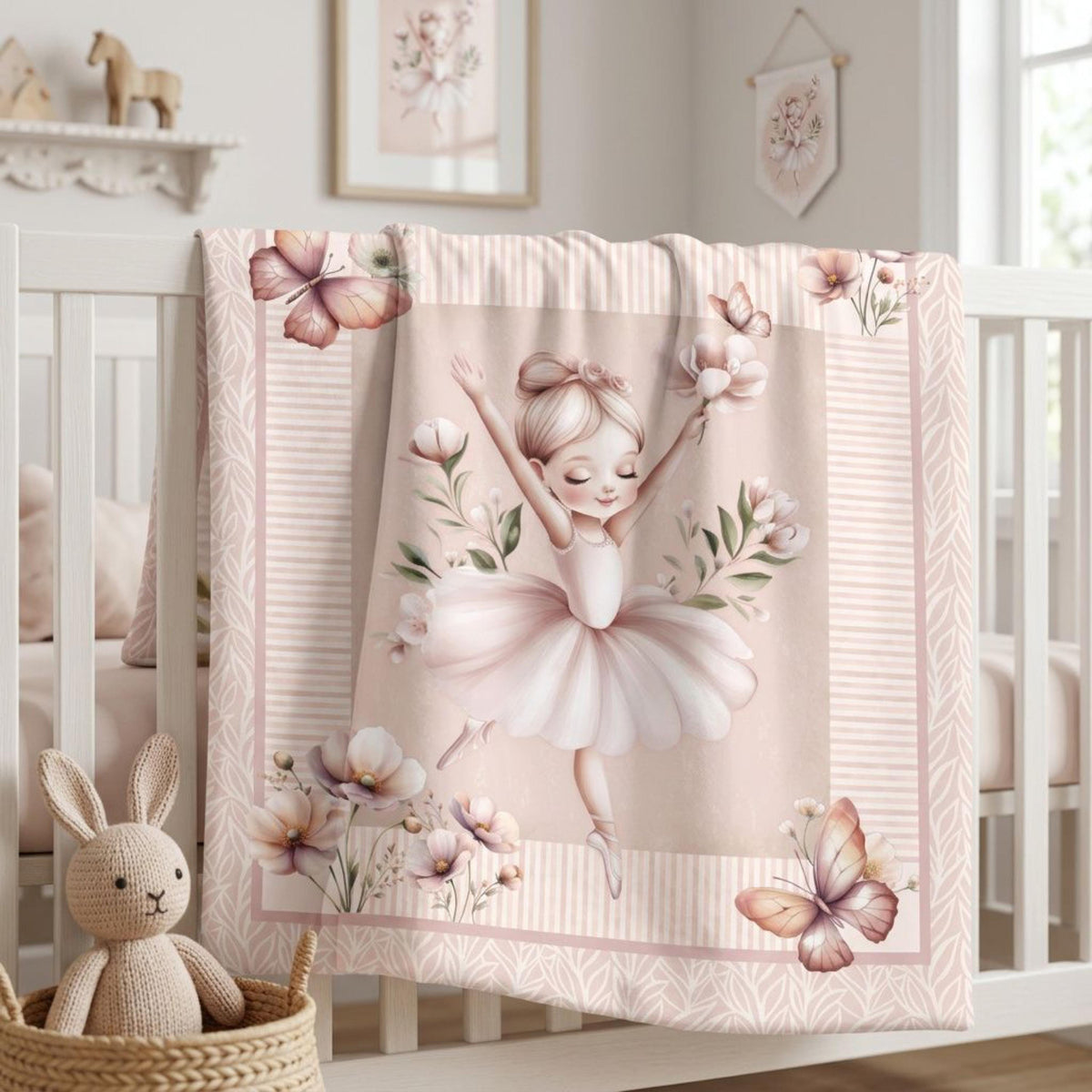 Finished ballerina baby quilt displayed on a crib