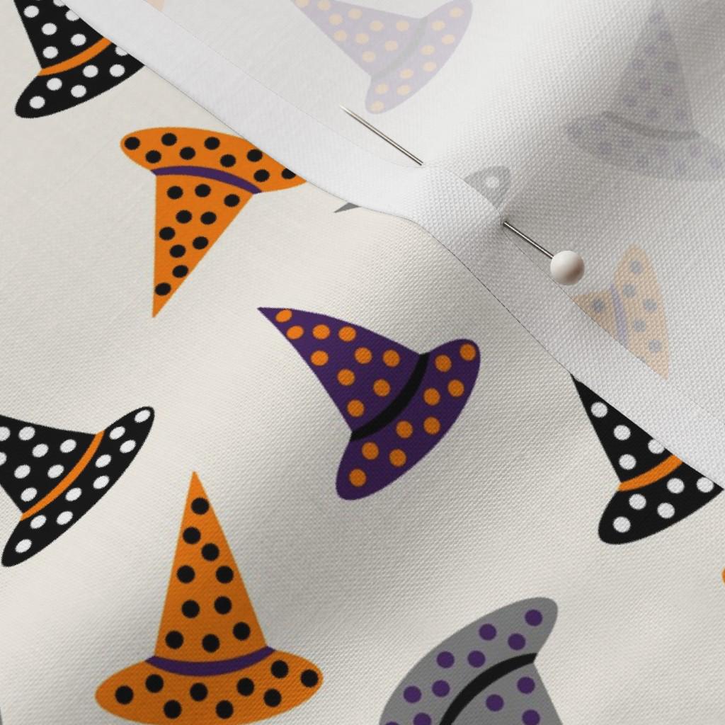 Witch hat print detail on Halloween quilting cotton