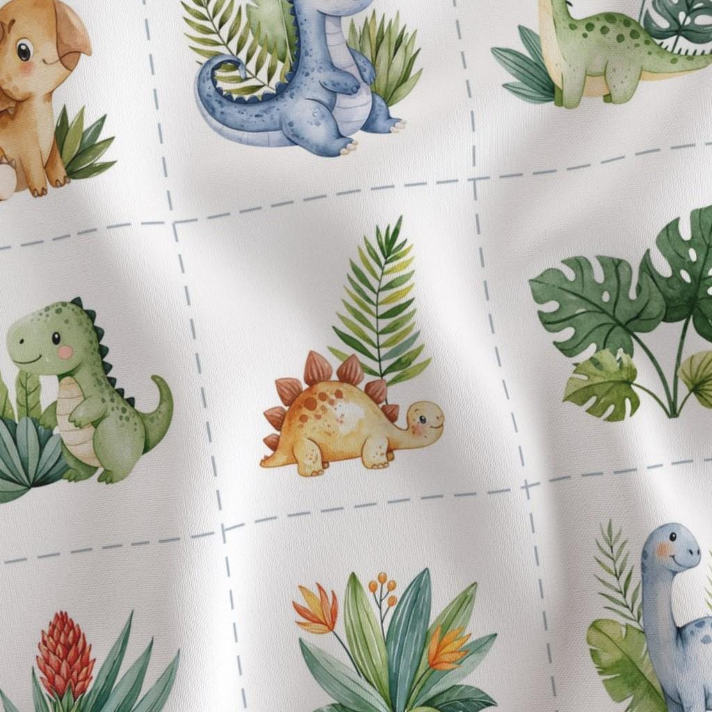 Close-up of fussy-cut baby dinosaurs and tropical leaves in 6-inch cut-apart blocks