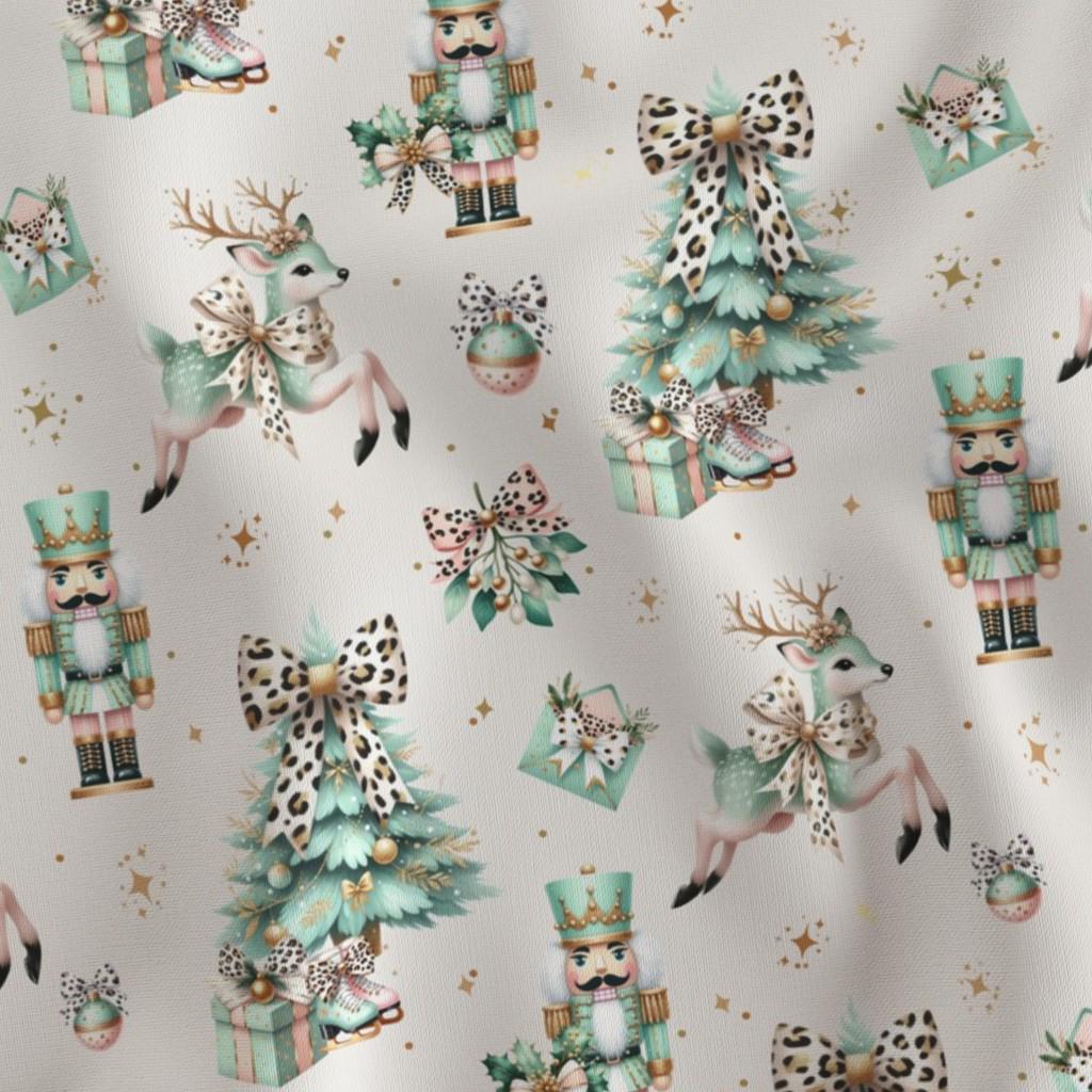 Coquette Christmas fabric showing the watercolor nutcracker and Christmas tree print on cotton quilting fabric
